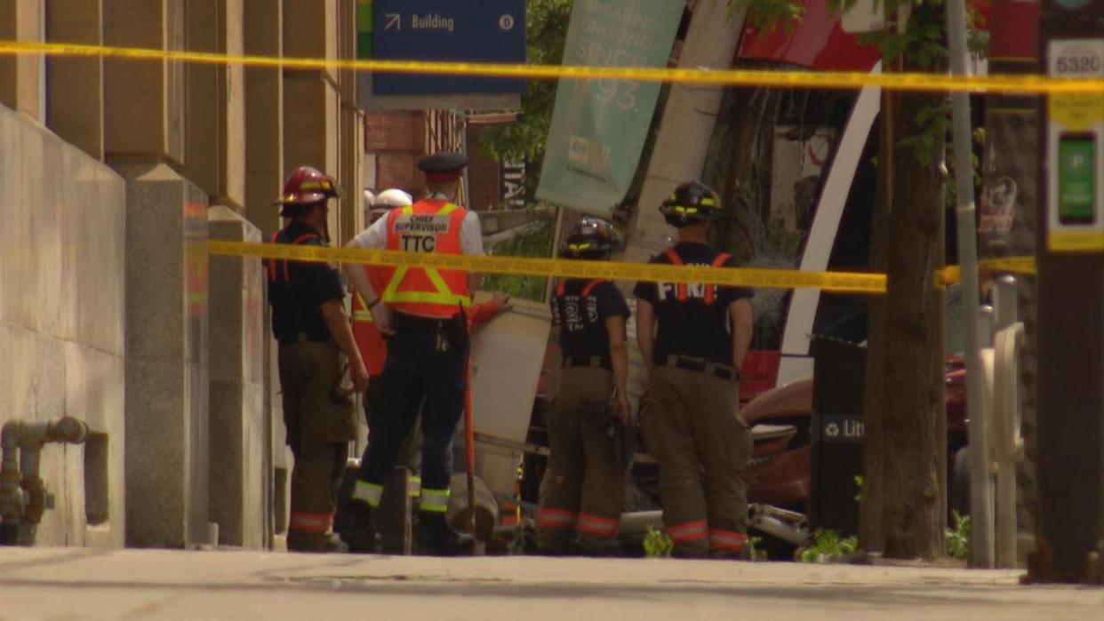 Toronto police are advising motorists to expect delays in the area of King and Frederick streets after a collision involving a TTC streetcar and a vehicle left three people injured. Roads in the area remain closed. (Ivan Arsovski/CBC - image credit)