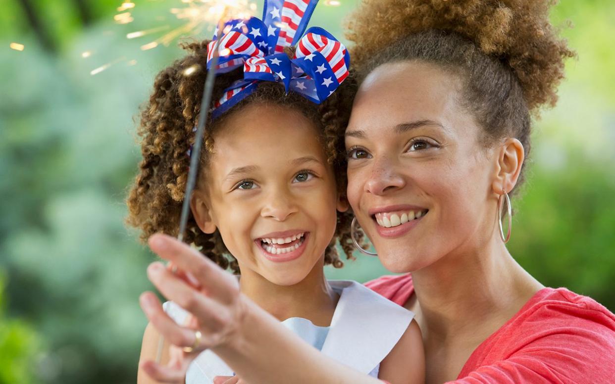 Black mother and daughter celebrating 4th of July