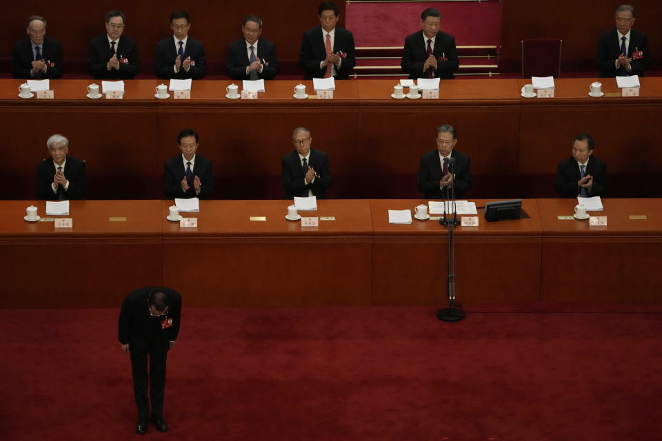 Chinese Premier Li Keqiang bows before delivering his state of the nation address at the opening session of China's National People's Congress (NPC) at the Great Hall of the People in Beijing, Sunday, March 5, 2023. After a decade in Chinese President Xi Jinping's shadow, Li Keqiang is taking his final bow as the country's premier, marking a shift away from the skilled technocrats who have helped steer the world's second-biggest economy in favor of officials known mainly for their unquestioned loyalty to China's most powerful leader in recent history. (AP Photo/Ng Han Guan)