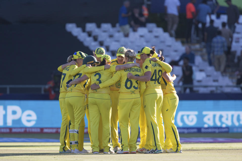 Australia celebrate beating India by 5 runs to commence to the Women's T20 World Cup Final in Cape Town, South Africa, Thursday Feb. 23, 2023. (AP Photo/Halden Krog)