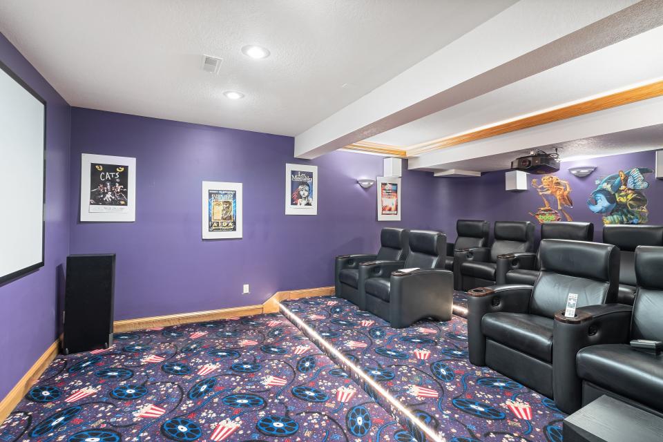 The theater room features three levels for viewing movies or TV shows.