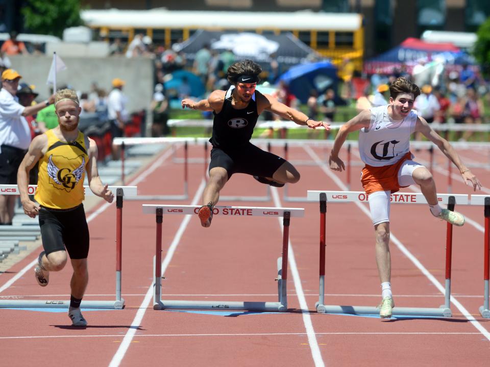 Ridgewood's Xavier Lamneck clears the final hurdle during the 300 intermediate hurdle finals during the Division II state track and field meet on Saturday at Jesse Owens Memorial Stadium. Lamneck finished in the top eight but was disqualified, as officials deemed his front leg went around a hurdle and not over it.