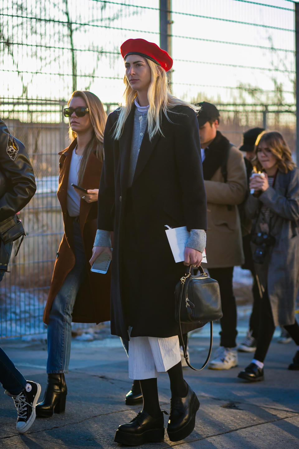 Kelly Connor in a red beret and creepers at New York Fashion Week.