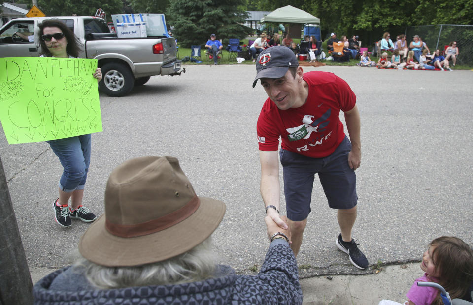 Dan Feehan, the Democratic candidate in Minnesota’s First District, works a parade in Waterville, Minn., in June. (Photo: Jim Mone/AP)