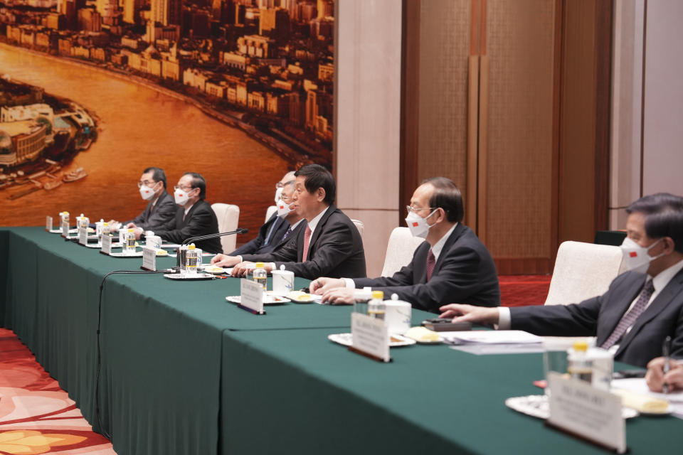 In this handout photo provided by the Malacanang Presidential Photographers Division, China's Chairman of the Standing Committee of the National People's Congress Li Zhanshu, center, meets with Philippine President Ferdinand Marcos Jr., not shown, at the Great Hall of the People, in Beijing, China, Wednesday Jan. 4, 2023. (Malacanang Presidential Photographers Division via AP)