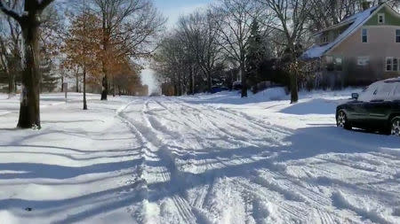 A snow-covered street is seen in Saint Paul, U.S., January 28, 2019 in this video grab obtained from social media video. Mark J. Westpfahl/via REUTERS