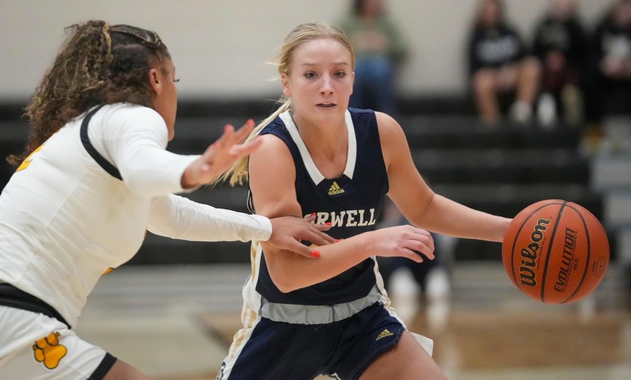 Fort Wayne Snider High School's Johnea Donahue (2) defends Norwell High School's Kennedy Fuelling at Noblesville High School, Dec 28, 2023. Ft. Wayne Snyder won 65-50.