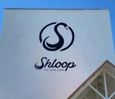 The sign at the site of the Shloop shoe factory set to open in Meridian, MIssissippi next month.