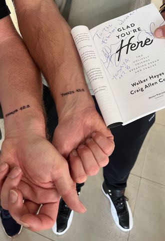 Courtesy of Craig Allen Cooper Walker Hayes and Craig Allen Cooper got matching tattoos while in Rwanda to honor Cooper's favorite Bible verse, Isaiah 42:8. The prophet's name is translated into Rwanda's language, Kinyarwanda.