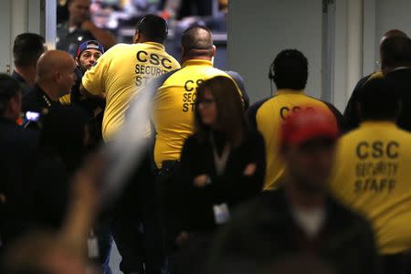 A protester is ejected by security as Republican U.S. presidential candidate Donald Trump holds a rally in Anaheim, California, U.S., May 25, 2016. REUTERS/Jonathan Ernst