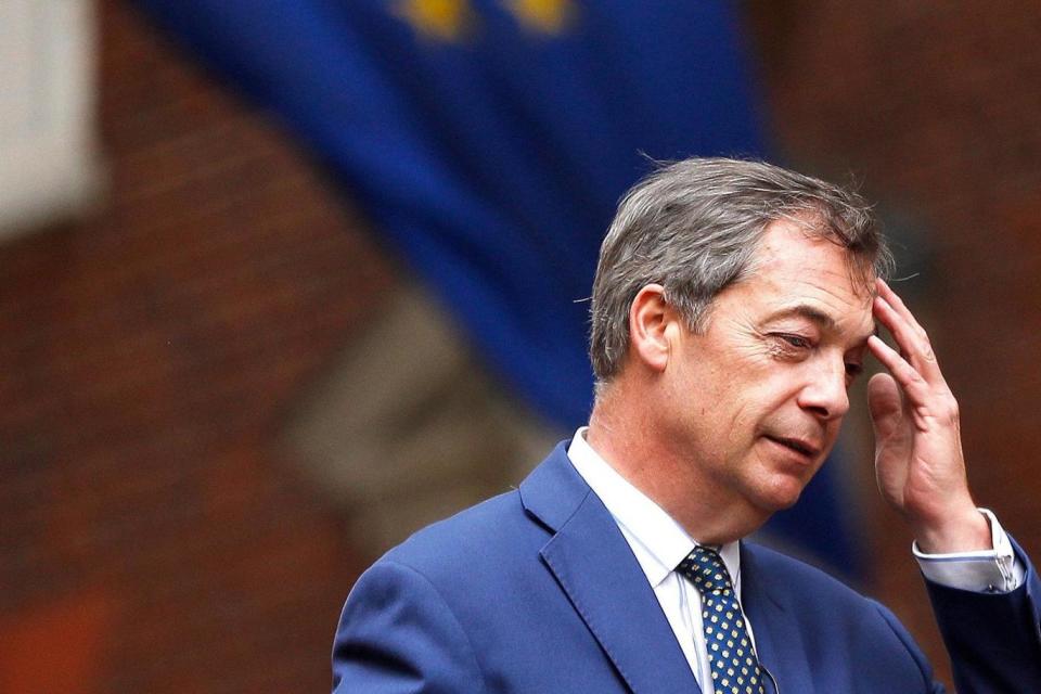 Nigel Farage passes a European Union flag as he rides a bus while campaigning against Britain's Prime Minister Theresa May's Chequers Brexit plan (REUTERS)