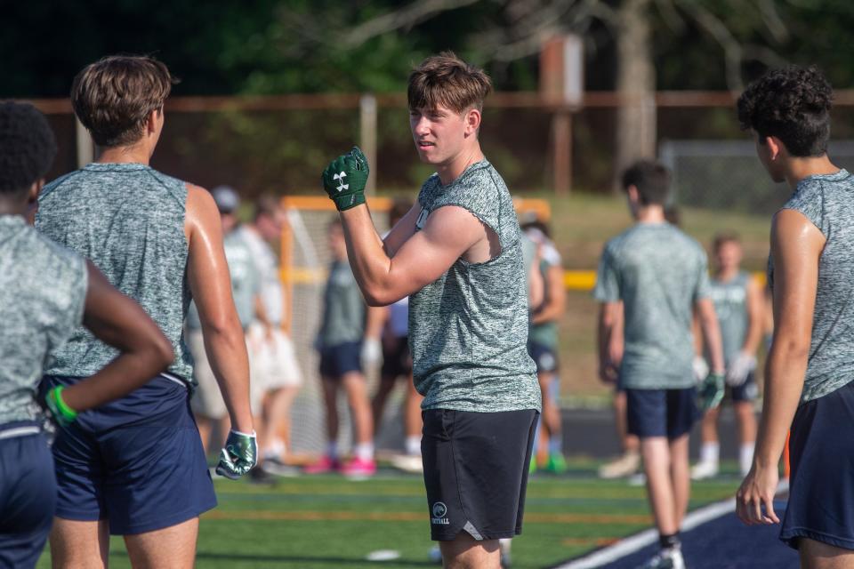 Colts Neck's Will Surdez talks to his teammates during the Freehold Regional high school 7 on 7 football tournament at Howell High School in Howell, NJ Thursday, July 21, 2022. 