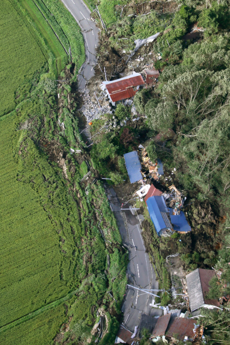 <em>This aerial photo shows houses destroyed by a landslide after an earthquake in Atsuma town (AP)</em>