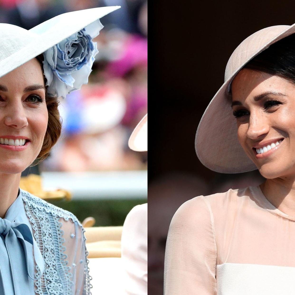  Catherine, Duchess of Cambridge and Meghan, Duchess of Sussex attend day twelve of the Wimbledon Tennis Championships at the All England Lawn Tennis and Croquet Club on July 14, 2018 in London, England. 