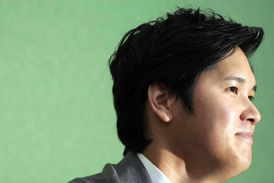 Los Angeles Angels' Shohei Ohtani listens to questions from journalists during a press conference at the Japan National Press Club Monday, Nov. 15, 2021, in Tokyo. (AP Photo/Eugene Hoshiko)