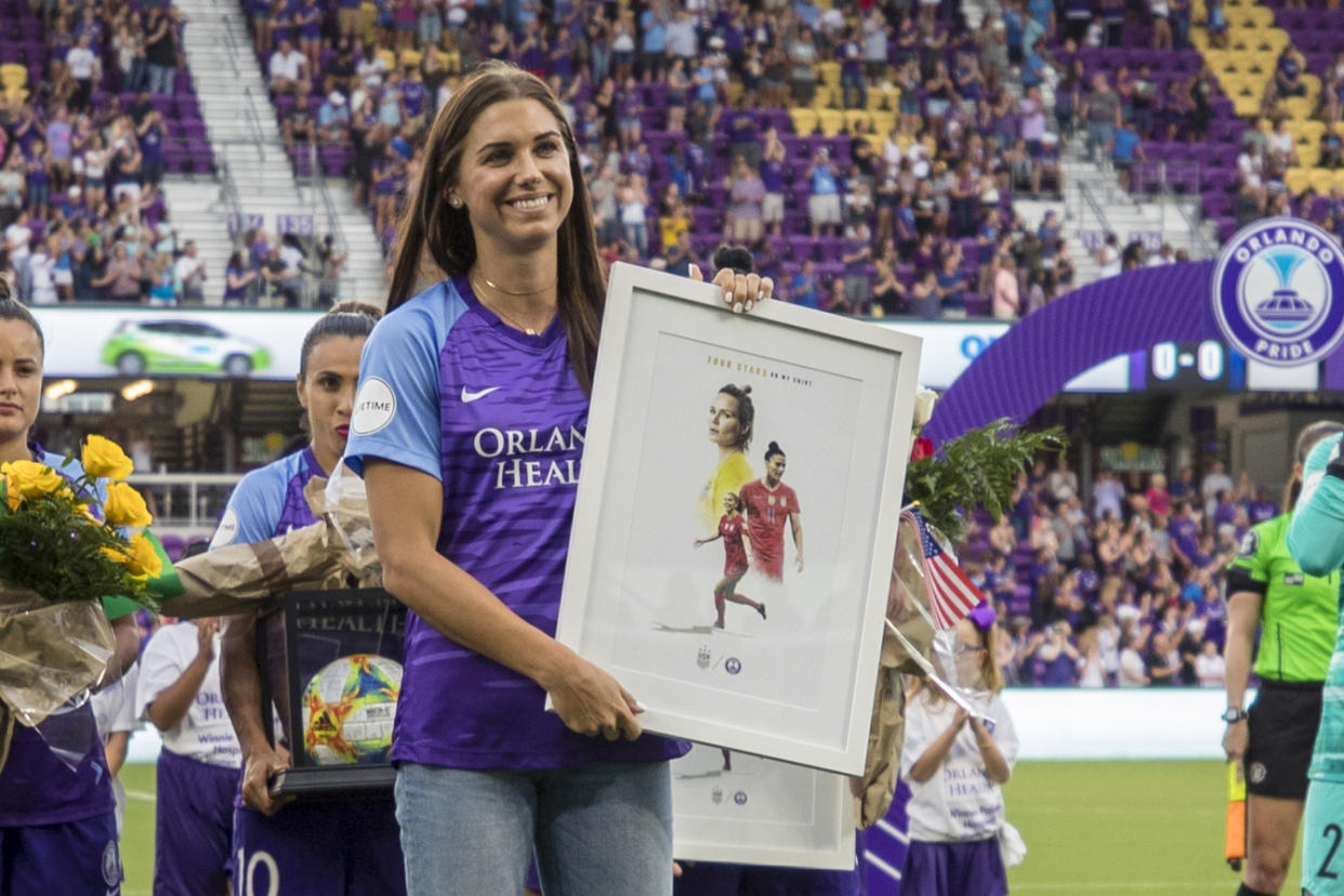 ORLANDO, FL - JULY 20: Orlando Pride forward Alex Morgan (13) is presented with a plaque before during the soccer match between Sky Blue FC and the Orlando Pride on July 20, 2019, at Exploria Stadium in Orlando FL. (Photo by Joe Petro/Icon Sportswire via Getty Images)