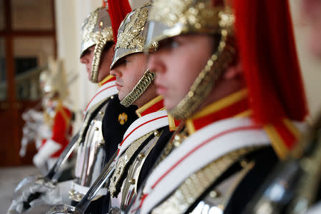 Guardsmen stand ready ahead of the arrival of Britain's Queen Elizabeth and King Willem-Alexander of the Netherlands, to Buckingham Palace, in London, Britain October 23, 2018. REUTERS/Peter Nicholls