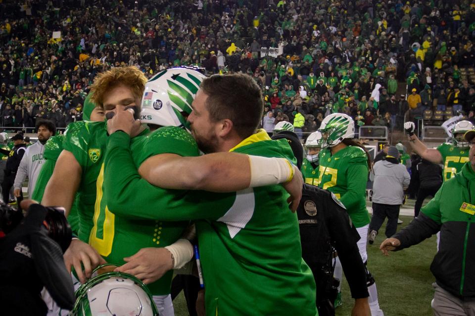 Oregon head coach Dan Lanning hugs quarterback Bo Nix after the Ducks win as the No. 12 Oregon Ducks host the No. 10 Utah Utes in Oregon’s final home game of the season at Autzen Stadium in Eugene, Ore. Saturday, Nov. 19, 2022. 