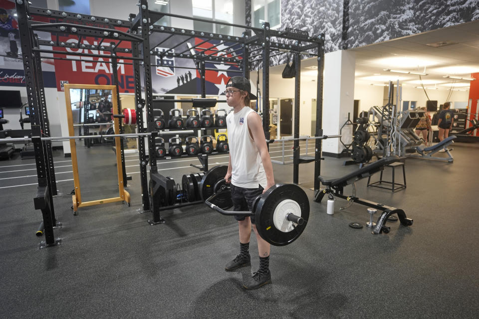 Freestyle skier Jay Riccomini trains at the U.S. Ski & Snowboard Center of Excellence on May 20, 2024, in Park City, Utah. Riccomini competes in the women's events at World Cup events as a transgender male. He's holding off on taking testosterone until his skiing career is finished. (AP Photo/Rick Bowmer)