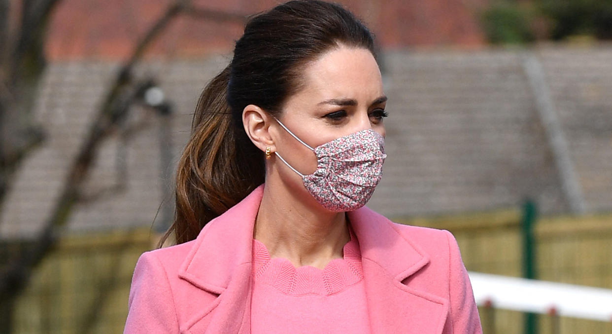 The Duchess of Cambridge brightens the dy with her bright pink ensemble - and it's from British high street retailer Boden.  (Getty Images)