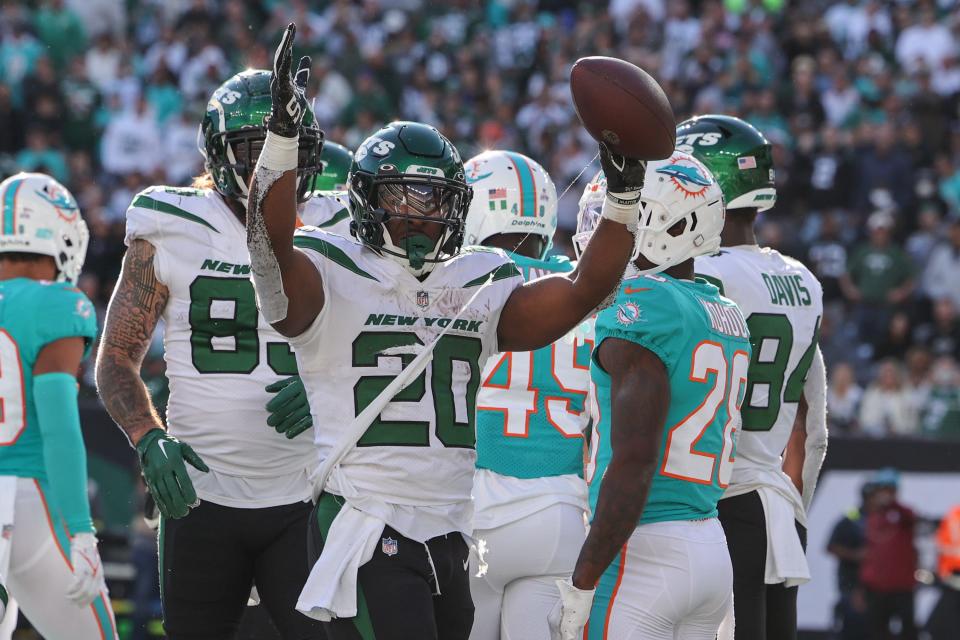 New York Jets running back Breece Hall (20) celebrates after scoring a touchdown against the Miami Dolphins during the second half at MetLife Stadium.