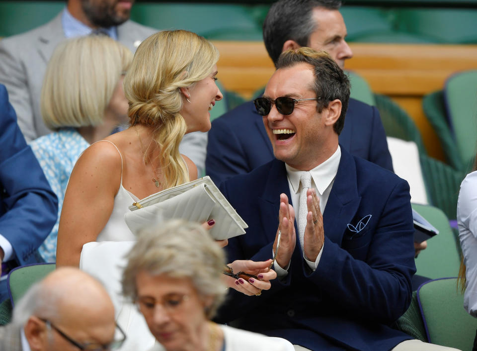 Tennis - Wimbledon - All England Lawn Tennis and Croquet Club, London, Britain - July 12, 2019 Jude Law and wife Phillipa Coan in the royal box before the semi-final match between Serbia's Novak Djokovic and Spain's Roberto Bautista Agut REUTERS/Toby Melville