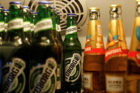 Bottles of Kingfisher and Tuborg beer are displayed in a fridge at a pub in Mumbai, India, October 20, 2018. REUTERS/Danish Siddiqui