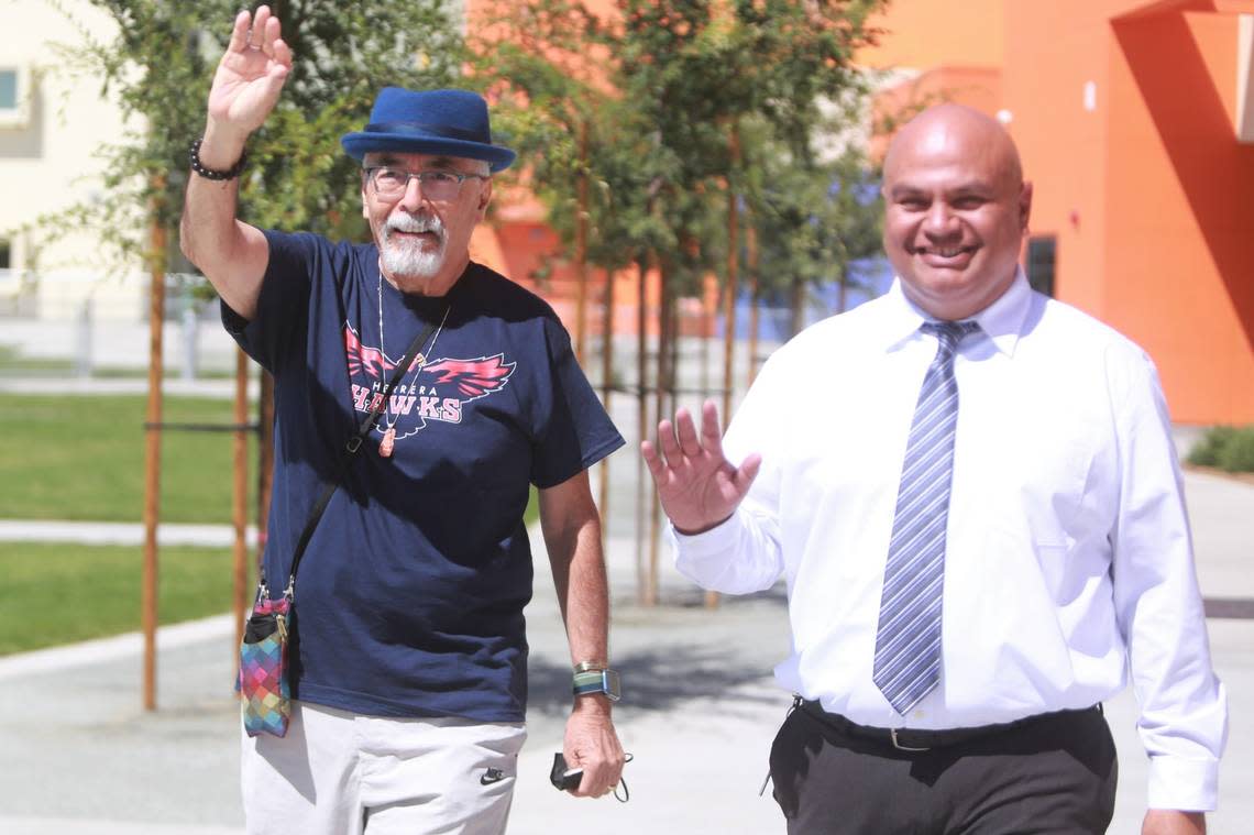 Juan Felipe Herrera and principal Miguel Naranjo on the first day that Juan Felipe Herrera Elementary School opened its doors on Aug. 15, 2022.