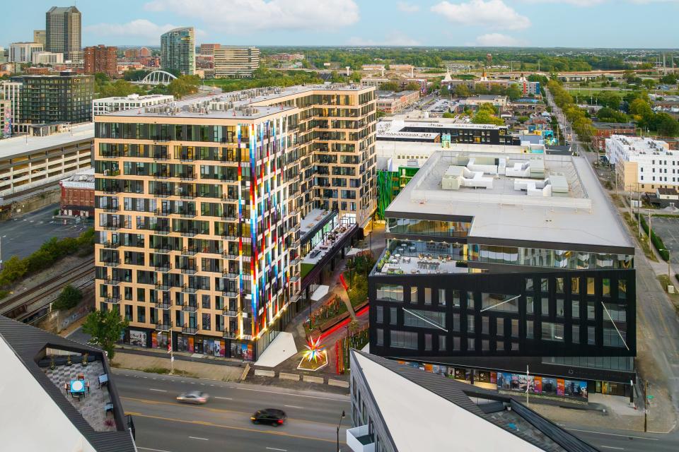 The second phase of the Gravity development on West Broad Street includes an apartment building, on the left, and an office building, on the right, above ground-level retail and commercial space. It has been listed for sale for an undisclosed price.