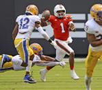 Miami quarterback D'Eriq King (1) scrambles in the second quarter against Pittsburgh during an NCAA college football game at Hard Rock Stadium in Miami Gardens, Fla., Saturday, Oct. 17, 2020. (Al Diaz/Miami Herald via AP)