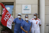 Employees demonstrating outside a nursing home of the Korian group, one of the market leaders in the lucrative industry of providing care and assisted living facilities for older adults, Monday, May 25, 2020 in Paris. In France, the group is facing several lawsuits filed by families who have lost loved ones during the coronavirus pandemic that has caused thousands of deaths in French care homes. (AP Photo/Thibault Camus)