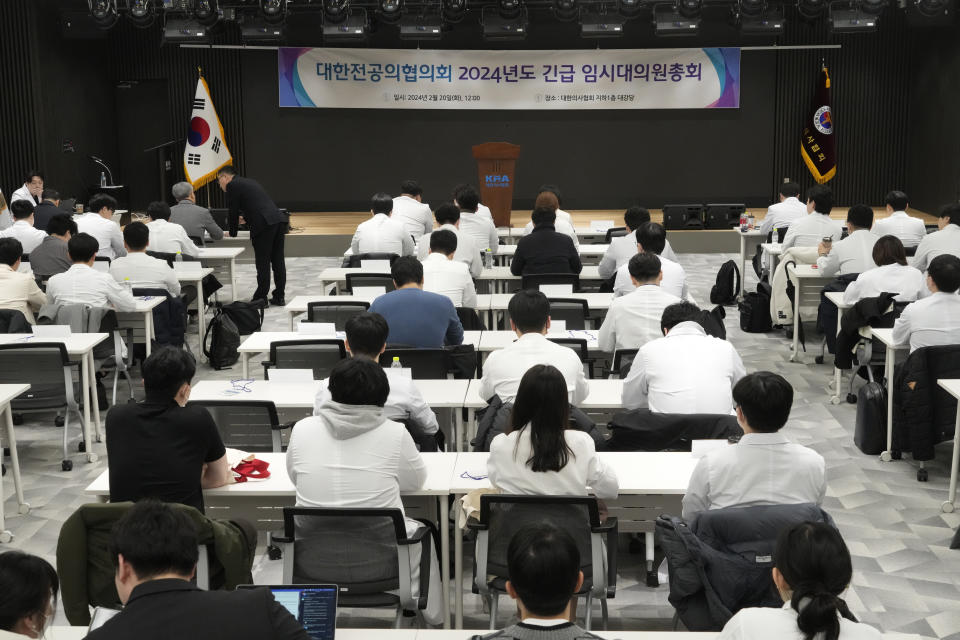 Trainee doctors attend a meeting at the Korea Medical Association building in Seoul, South Korea, Tuesday, Feb. 20, 2024. South Korean trainee doctors collectively walked off their jobs Tuesday to escalate their protest of a government medical policy, triggering cancellations of surgeries and other medical treatments at hospitals. (AP Photo/Ahn Young-joon)