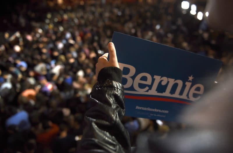 A supporter of U.S. Democratic presidential candidate Senator Sanders holds a Bernie campaign sign as she waits for him to arrive for a campaign rally in San Antonio