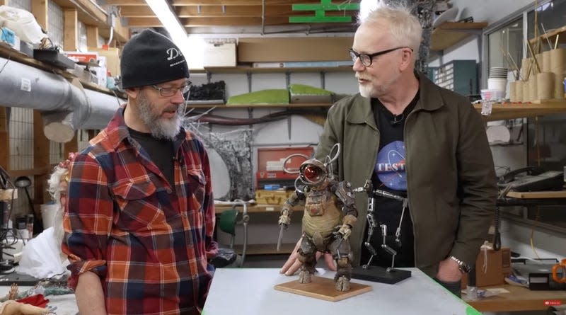 A Tippett Studios animator and Adam Savage with a stop-motion puppet