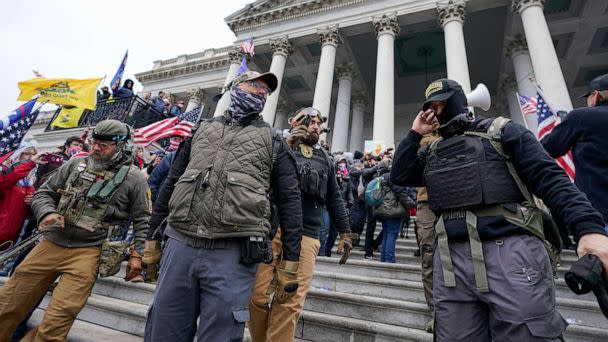 PHOTO: Members of the Oath Keepers extremist group stand on the East Front of the U.S. Capitol on Jan. 6, 2021, in Washington. The defendants facing jurors in the latest trial are Joseph Hackett, Roberto Minuta, David Moerschel and Edward Vallejo. (Manuel Balce Ceneta/AP, FILE)