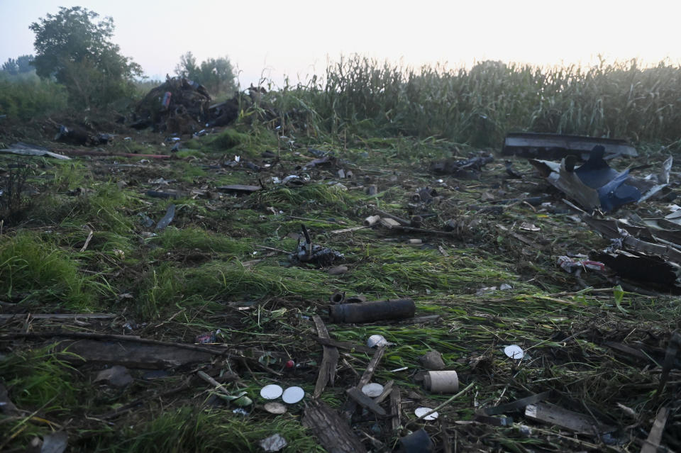 Debris of an Antonov cargo plane is seen in Palaiochori village in northern Greece, Sunday, July 17, 2022, after it reportedly crashed Saturday near the city of Kavala. The An-12, a Soviet-built turboprop aircraft operated by the Ukrainian cargo carrier Meridian, crashed late Saturday as Greek Civil Aviation authorities said the flight was heading from Serbia to Jordan. (AP Photo/Giannis Papanikos)