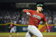 Mexico's Joey Meneses celebrates as he runs the bases after hitting a three-run home run against the United States during the fourth inning of a World Baseball Classic game in Phoenix, Sunday, March 12, 2023. (AP Photo/Godofredo A. Vásquez)