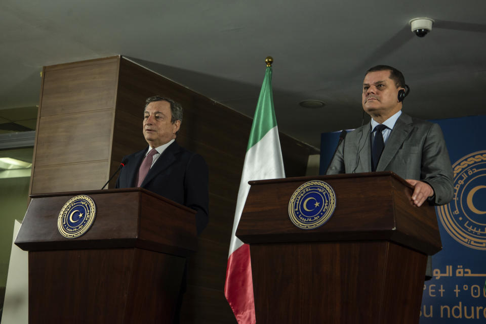 Abdul Hamid Dbeibeh, the Prime Minister of the Government of National Unity, right, and Mario Draghi, the Prime Minister of Italy, speak to media, Tuesday, April, 6 2021 in Tripoli, Libya. (AP Photo/Nada Harib)