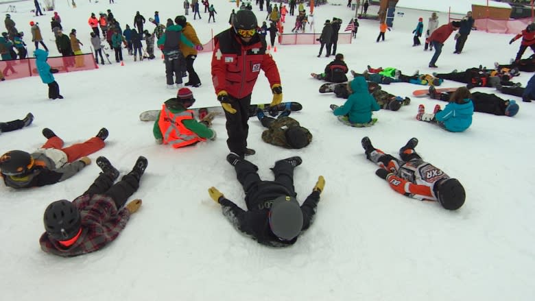 Skiers and boarders lie down for a world record attempt at Spring Hill