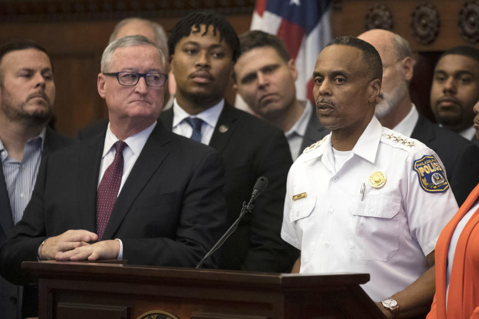 In this Thursday, Aug. 15, 2019 photo, Philadelphia Police Commissioner Richard Ross, right, speaks during a news conference as Mayor Jim Kenney looks on at City Hall in Philadelphia. The mayor of Philadelphia says on Tuesday, Aug. 20, 2019, that Ross is resigning over new allegations of sexual harassment and racial and gender discrimination against others in the department. Kenney says that Richard Ross has been a terrific asset to the police department and the city as a whole and that he's disappointed to lose him. (AP Photo/Matt Rourke)