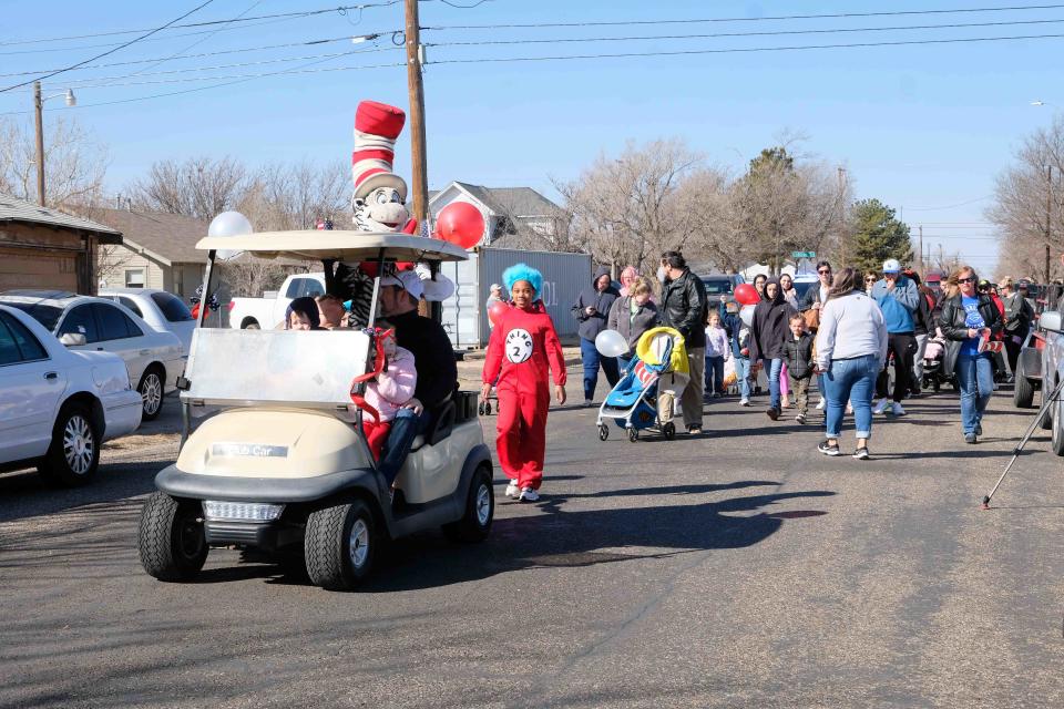 The Cat in the Hat leads the  “Cat in the Hat March” celebrating Read Across America in Amarillo.