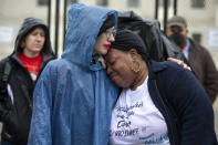 Estephanie Ward gives Jannie Mitchell a hug after she shared her story about her children being seized in Philadelphia during a demonstration outside of the U.S. Supreme Court, Saturday, May 7, 2022, in Washington. A draft opinion suggests the U.S. Supreme Court could be poised to overturn the landmark 1973 Roe v. Wade case that legalized abortion nationwide, according to a Politico report released Monday. Whatever the outcome, the Politico report represents an extremely rare breach of the court's secretive deliberation process, and on a case of surpassing importance. (AP Photo/Amanda Andrade-Rhoades)