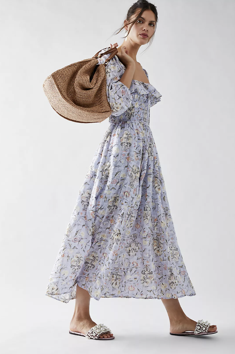 brunette model wearing long sleeve light blue floral Oasis Printed Midi Dress (photo via Free People)