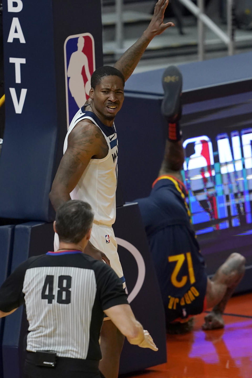 Minnesota Timberwolves forward Ed Davis, left, gestures toward referee Scott Foster (48) after fouling Golden State Warriors guard Kelly Oubre Jr. (12) during the first half of an NBA basketball game in San Francisco, Wednesday, Jan. 27, 2021. (AP Photo/Jeff Chiu)