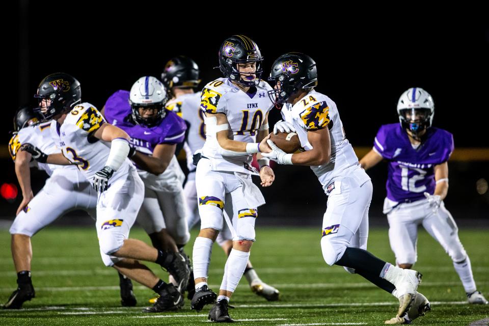 Jaxon Cherry takes the ball from his QB, Ty McKinney, during a game in the 2022 season. Despite racking up stellar stats, Cherry has gone under-recruited and is one of the best-kept secrets in Iowa.