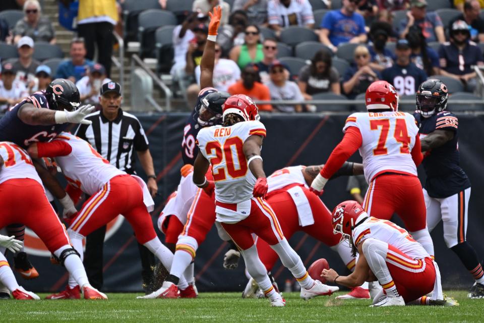 Kansas City Chiefs safety Justin Reid (20) kicks the extra point uring a preseason game against the Chicago Bears on Saturday.