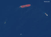 This satellite image provided by Maxar Technologies shows the oil tanker Front Altair off the coast of Fujairah, United Arab Emirates, Monday, June 17, 2019. New satellite photos released Monday show two oil tankers apparently attacked in the Gulf of Oman last week. The U.S. alleges Iran used limpet mines to strike the two tankers. Iran has denied being involved. (Satellite image ©2019 Maxar Technologies via AP)