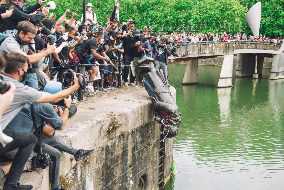 The statue of Colston is pushed into the river Avon. Edward Colston was a slave trader of the late 17th century who played a major role in the development of the city of Bristol, England, on June 7, 2020. (Photo by Giulia Spadafora/NurPhoto via Getty Images)