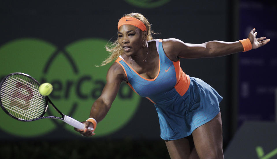 Serena Williams, of the United States, returns the ball to Angelique Kerber, of Germany, during the Sony Open tennis tournament, Tuesday, March 25, 2014, in Key Biscayne, Fla. (AP Photo/Luis M. Alvarez)