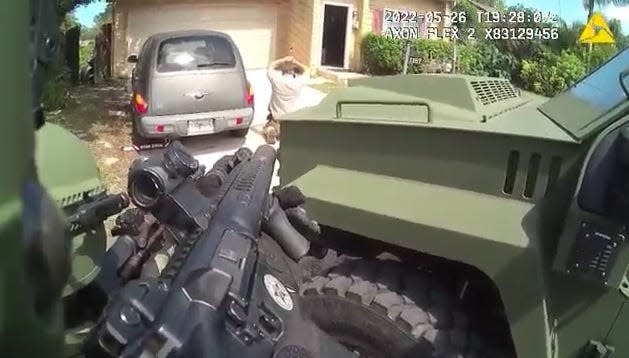 A still image from a Volusia deputy's body camera shows Curtis Lapiere Jr. surrendering in the driveway of a home near Port Orange on Southfork Court on Thursday, May 26. Lapiere is accused of pointing a gun at deputies who were trying to evict the suspect at the request of his father.